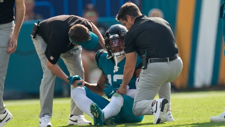 Jacksonville Jaguars wide receiver Christian Kirk (13) is helped to his fett after being injured during the second half of an NFL football game against the Green Bay Packers Monday, Oct. 28, 2024, in Jacksonville, Fla. (John Bazemore/AP)