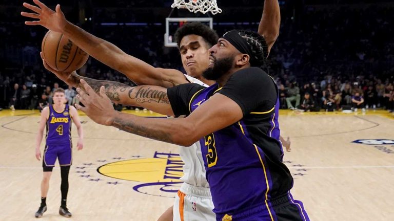 Los Angeles Lakers forward Anthony Davis (3) goes to the basket against Phoenix Suns center Oso Ighodaro during the first half of an NBA basketball game. (Eric Thayer/AP)