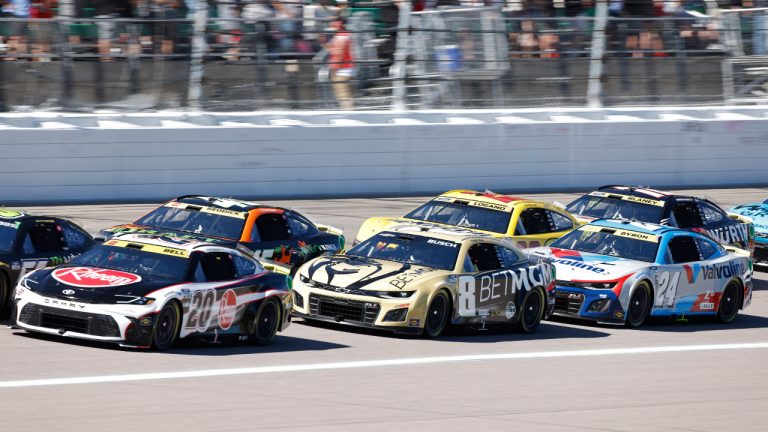 Christopher Bell (20), Kyle Busch (8), William Byron (24), Tyler Reddick (45), Joey Logano (22) and Ryan Blaney (12) head down the front straightaway after a caution flag during a NASCAR Cup Series auto race at Kansas Speedway in Kansas City, Kan., Sunday, Sept. 29, 2024. (Colin E. Braley/AP)