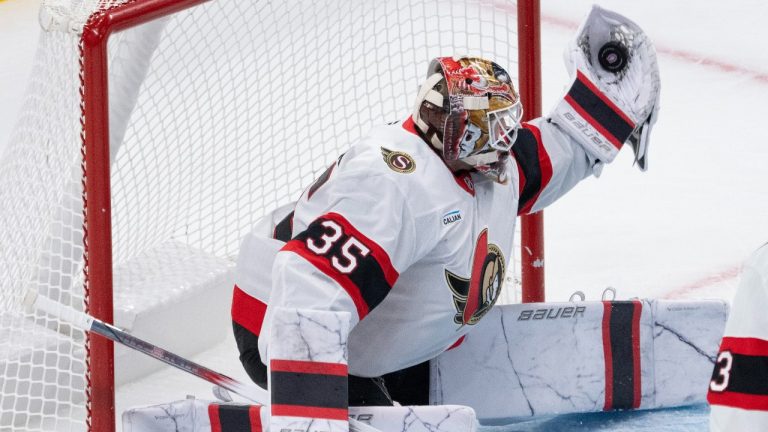 Ottawa Senators goaltender Linus Ullmark (35) makes a glove save during third period NHL pre-season hockey action against the Montreal Canadiens on Tuesday, October 1, 2024 in Montreal. (Ryan Remiorz/THE CANADIAN PRESS)