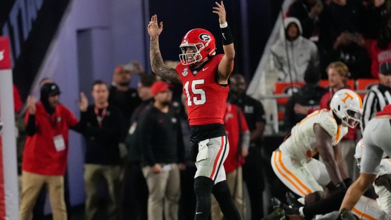 Georgia quarterback Carson Beck (15) reacts after a Georgia touchdown during the second half of an NCAA college football game against Tennessee, Saturday, Nov. 16, 2024, in Athens, Ga. (John Bazemore/AP)