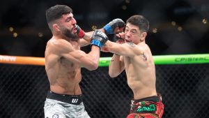 Brandon Moreno, right, punches Amir Albazi during the main event flyweight bout at UFC Fight Night in Edmonton on Saturday, November 2, 2024. (Jason Franson/CP)