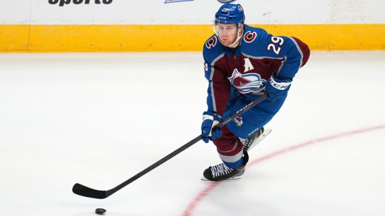 Colorado Avalanche center Nathan McKinnon (29) moves the puck up the ice against the Chicago Blackhawks during the first period of an NHL hockey game Wednesday, Oct. 12, 2022, in Denver. (Jack Dempsey/AP) 