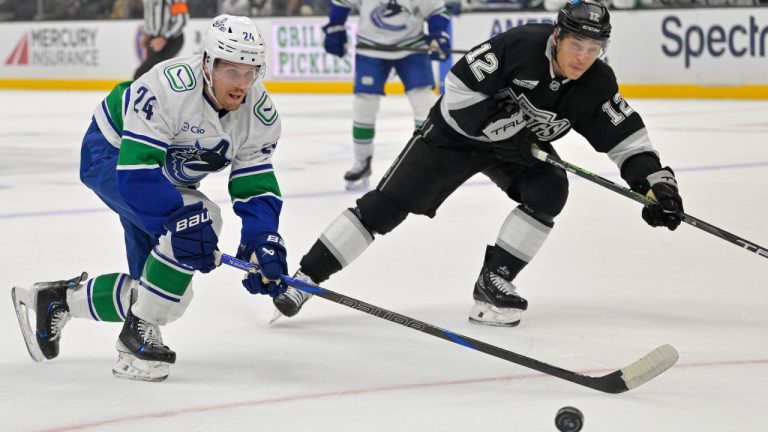 Vancouver Canucks center Pius Suter, left, and Los Angeles Kings left wing Trevor Moore chase down the puck during the first period of an NHL hockey game, Thursday, Nov. 7, 2024, in Los Angeles. (Jayne-Kamin-Oncea/AP)