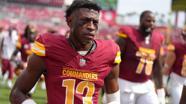 Washington Commanders cornerback Emmanuel Forbes Jr. (13) leaves the field following pregame warmups before an NFL football game against the Tampa Bay Buccaneers, Sunday, Sept. 8, 2024, in Tampa, Fla. (AP Photo/Peter Joneleit)