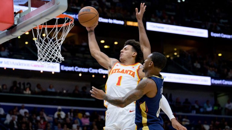 Atlanta Hawks forward Jalen Johnson (1) dunks against New Orleans Pelicans forward Jamal Cain (8) during the second half of an NBA basketball game in New Orleans, Sunday, Nov. 3, 2024. (Matthew Hinton/AP)