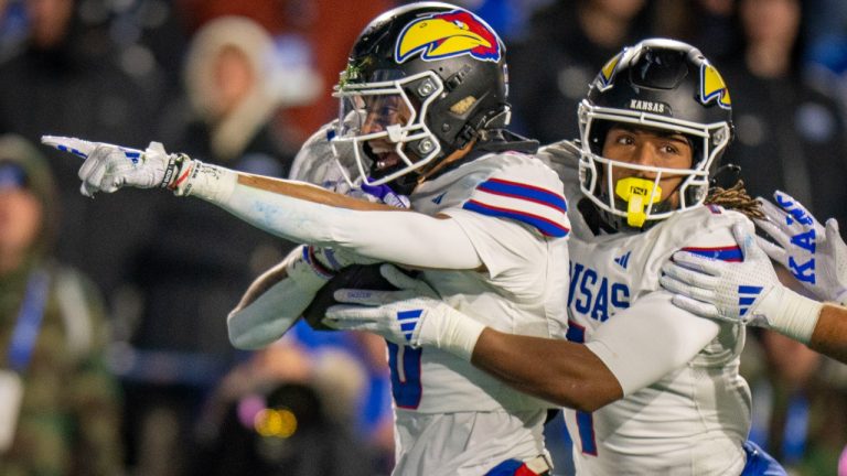 Kansas Jayhawks wide receiver Quentin Skinner, left, and Kansas wide receiver Trevor Wilson, right, celebrate a recovered fumble, during the second half of an NCAA college football game Saturday, Nov. 16, 2024, in Provo. (Rick Egan/AP)