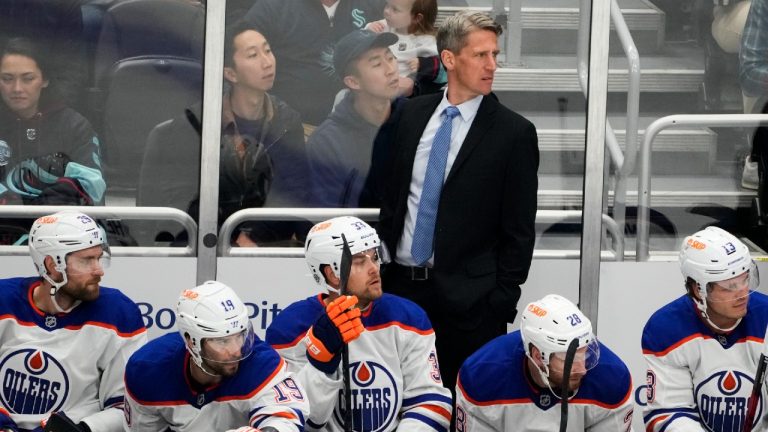 Edmonton Oilers head coach Kris Knoblauch watches from the bench during the first period of a preseason NHL hockey game against the Seattle Kraken, Wednesday, Oct. 2, 2024, in Seattle. (Lindsey Wasson/AP)