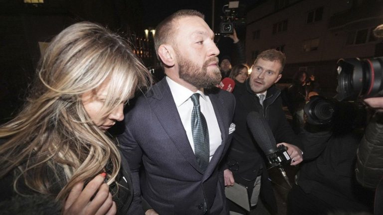 Mixed martial arts fighter Conor McGregor and partner Dee Devlin leave the High Court in Dublin, Ireland, Friday Nov. 22, 2024. (Brian Lawless/PA via AP)