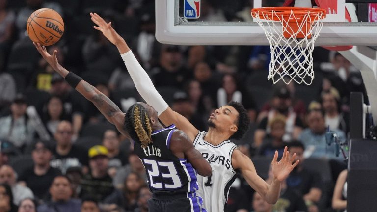 Sacramento Kings guard Keon Ellis drives to the basket against San Antonio Spurs center Victor Wembanyama during the second half of an NBA game in San Antonio, Monday, Nov. 11, 2024. (AP)