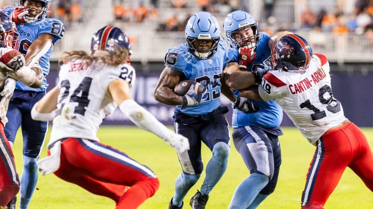 Toronto Argonauts running back Ka'Deem Carey (25) runs in a touchdown during first half CFL action against the Montreal Alouettes. (Nick Iwanyshyn/THE CANADIAN PRESS)