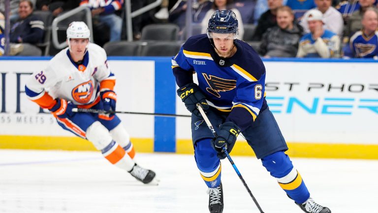 St. Louis Blues' Philip Broberg (6) controls the puck ahead of New York Islanders' Brock Nelson (29) during the third period of an NHL hockey game Thursday, Oct. 17, 2024, in St. Louis. (Scott Kane/AP)