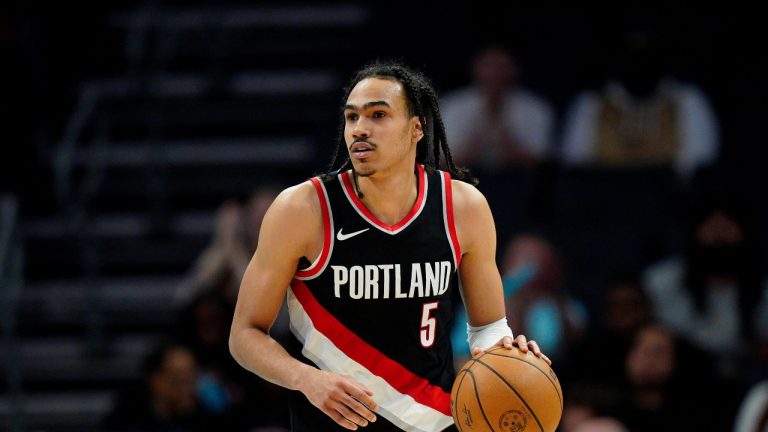 Portland Trail Blazers guard Dalano Banton (5) brings the ball up the court against the Charlotte Hornets during the second half of an NBA basketball game Wednesday, April 3, 2024, in Charlotte, N.C. (Jacob Kupferman/AP)
