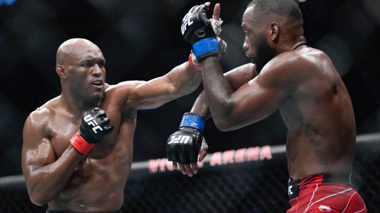 Kamaru Usman, left, fights with Leon Edwards during their welterweight championship bout at UFC 278 in Salt Lake City in 2022. (Francisco Kjolseth/The Salt Lake Tribune via AP)
