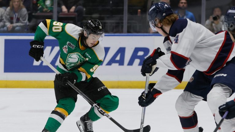 London Knights' Landon Sim (90) drives against Saginaw Spirit's Will Bishop (4) during first period Memorial Cup hockey action in Saginaw, Mich., Wednesday, May 29, 2024. (Duane Burleson/AP)
