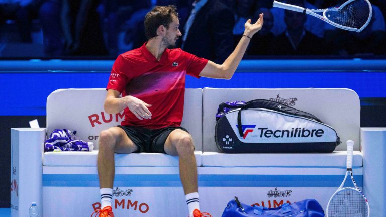 Daniil Medvedev throws a broken racket during his singles tennis match of the ATP World Tour Finals against Taylor Fritz, of the United States, at the Pala Alpitour, in Turin, Italy, Sunday, Nov. 10, 2024. (Marco Alpozzi/LaPresse via AP)