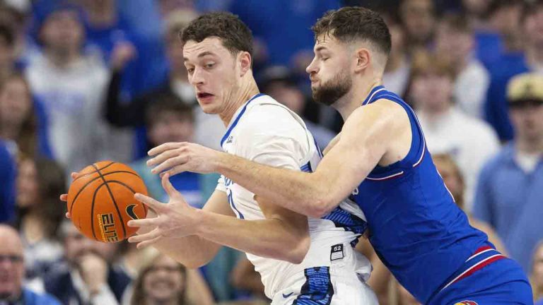 Creighton's Ryan Kalkbrenner, left, drives against Kansas' Hunter Dickinson during the first half of an NCAA college basketball game Wednesday, Dec. 4, 2024, in Omaha, Neb. (Rebecca S. Gratz/AP)