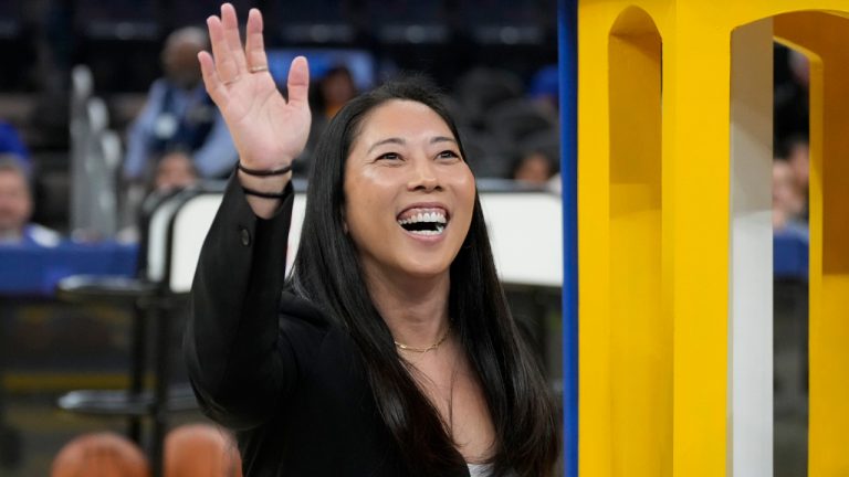 Golden State Valkyries WNBA head coach Natalie Nakase waves before an NBA preseason basketball game between the Golden State Warriors and the Sacramento Kings in San Francisco, Friday, Oct. 11, 2024. (AP Photo/Jeff Chiu)