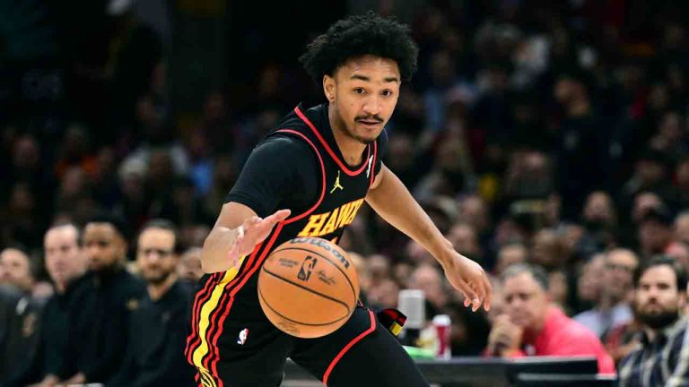 Atlanta Hawks guard Kobe Bufkin dribbles away from Cleveland Cavaliers guard Sam Merrill in the first half of an NBA basketball game, Wednesday, Nov. 27, 2024, in Cleveland. (David Dermer/AP)