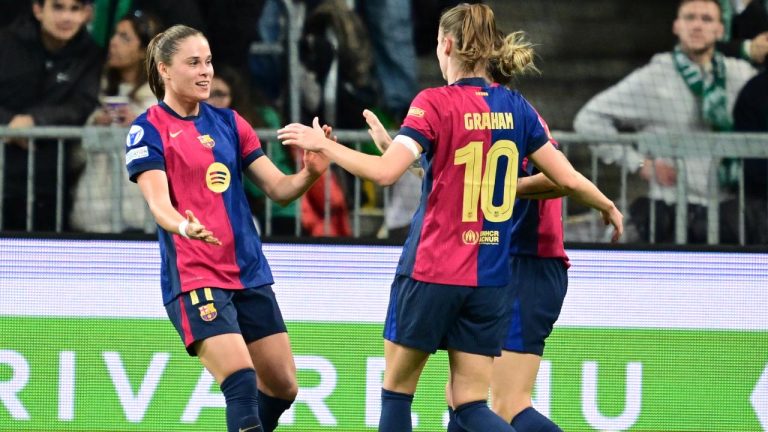 Barcelona's Ewa Pajor, left, celebrates scoring during the Champions League group D women's match between Hammarby IF and FC Barcelona. (Jonas Ekströmer/TT via AP)