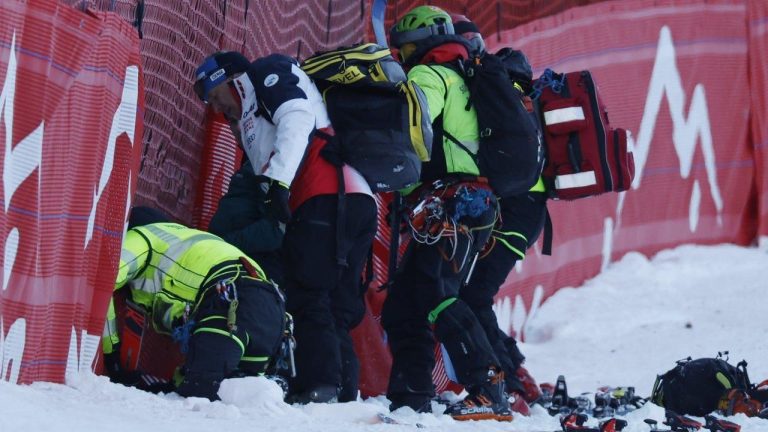 Medical staff are helping France's Cyprien Sarrazin after crashing during an alpine ski, men's World Cup downhill training, in Bormio, Italy. (Alessandro Trovati/AP)
