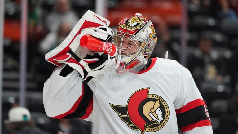 Ottawa Senators goaltender Mads Sogaard drinks liquid during the first period of an NHL hockey game against the Anaheim Ducks Wednesday, March 6, 2024, in Anaheim, Calif. (Jae C. Hong/AP)
