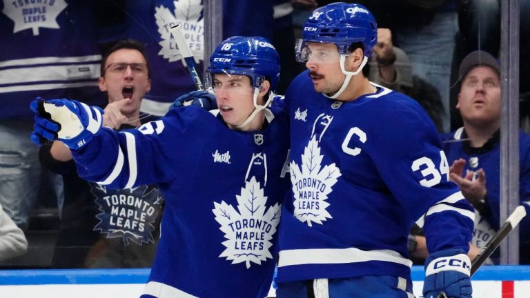 Toronto Maple Leafs' Auston Matthews (34) celebrates his goal against the Nashville Predators with Mitch Marner (16) during third period NHL hockey action in Toronto on Wednesday, December 4, 2024. (Frank Gunn/CP)