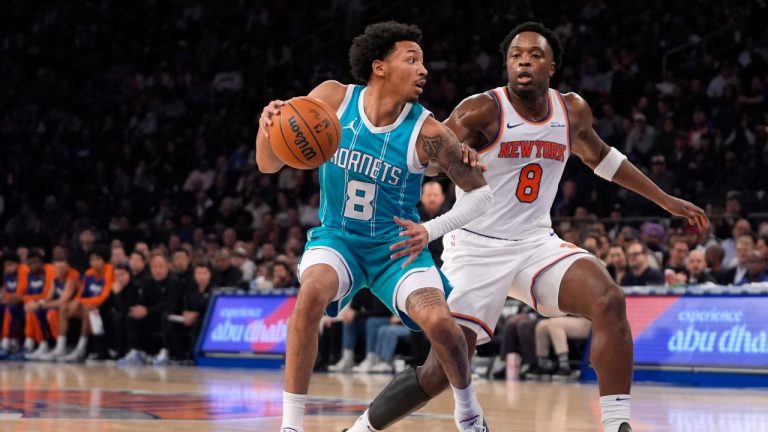 Charlotte Hornets' Nick Smith Jr., left, dribbles the ball against New York Knicks' OG Anunoby, right, during the first half of an NBA basketball game Thursday, Dec. 5, 2024, in New York. (Pamela Smith/AP)