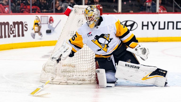 Pittsburgh Penguins goaltender Tristan Jarry retrieves his stick during the second period of the team's NHL hockey game against the New Jersey Devils in Newark, N.J., Tuesday, March 19, 2024. (Peter K. Afriyie/AP)