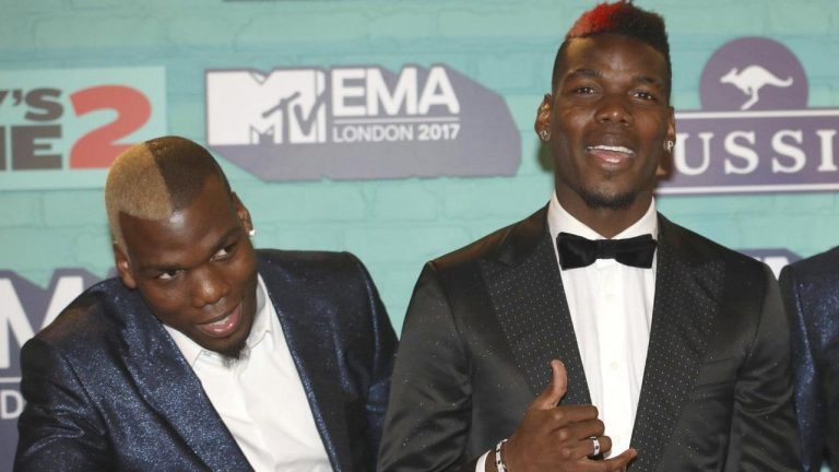 Soccer players Mathias Pogba, left, and Paul Pogba pose for photographers. (Vianney Le Caer/Invision/AP)