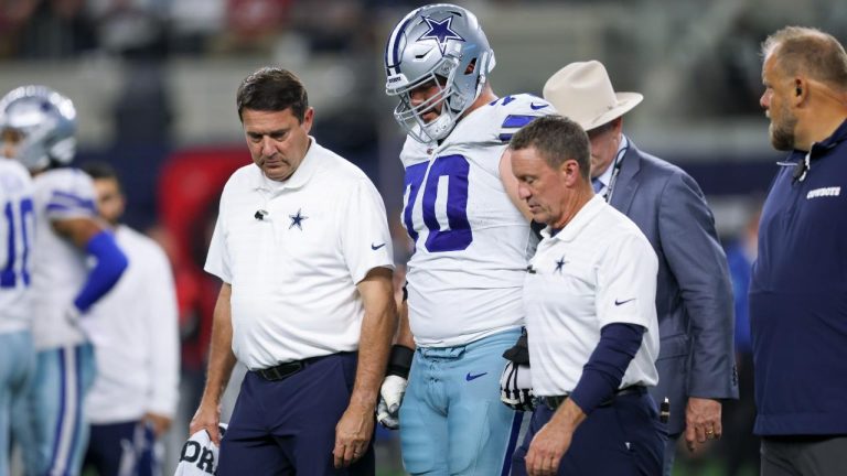 Dallas Cowboys guard Zack Martin (70) is helped off the field by medical staff during an NFL football game against the Houston Texans, Monday, Nov. 18, 2024. (Gareth Patterson/AP)