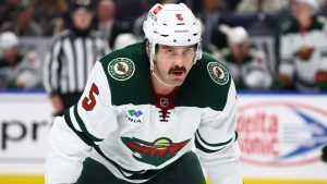 Minnesota Wild defenseman Jake Middleton (5) lines up for a faceoff during the second period of an NHL hockey game against the Buffalo Sabres Wednesday, Nov. 27, 2024, in Buffalo, N.Y. (Jeffrey T. Barnes/AP)