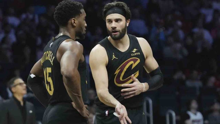 Cleveland Cavaliers guard Donovan Mitchell talks with guard Max Strus, right, during the first half of an NBA basketball game against the Miami Heat, Wednesday, Jan. 29, 2025, in Miami. (Lynne Sladky/AP)
