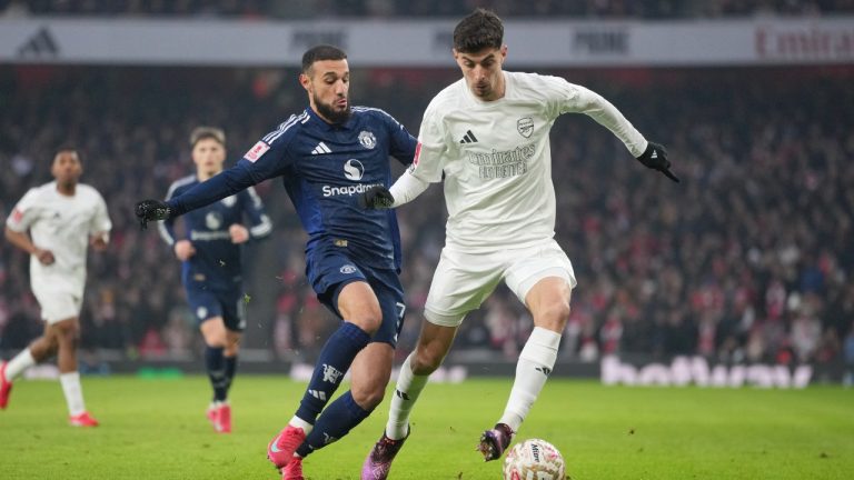 Arsenal's Kai Havertz, right, challenges for the ball with Manchester United's Mason Mount during the English FA Cup soccer match between Arsenal and Manchester United at the Emirates stadium in London, Sunday, Jan. 12, 2025. (Kin Cheung/AP)