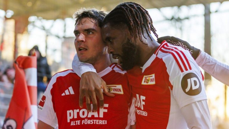 Berlin's Robert Skov, left, and his teammate Jordan Siebatcheu, right, celebrate their side's second goal during the German Bundesliga soccer match between 1. FC Union Berlin and 1. FSV Mainz 05 in Berlin, Germany, Sunday, Jan. 19, 2025. (Andreas Gora/dpa via AP)