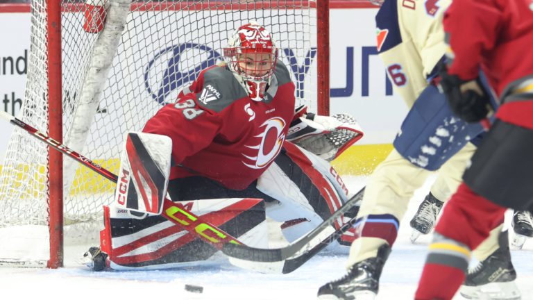 Ottawa Charge goaltender Emerance Maschmeyer eyes the puck as Montreal Victoire's Clair Degeorge tries to score during third period PWHL hockey action in Ottawa on Friday, Dec. 6, 2024. (Patrick Doyle/CP)
