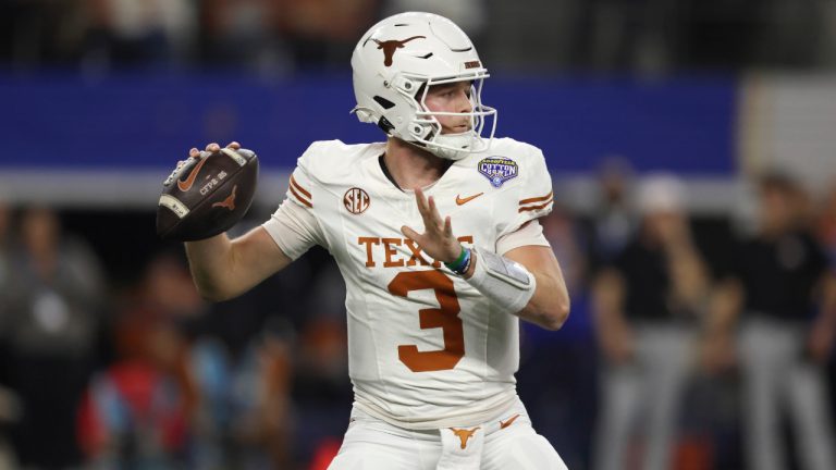Texas quarterback Quinn Ewers passes against Ohio State during the first half of the Cotton Bowl College Football Playoff semifinal game, Friday, Jan. 10, 2025. (AP Photo/Gareth Patterson)