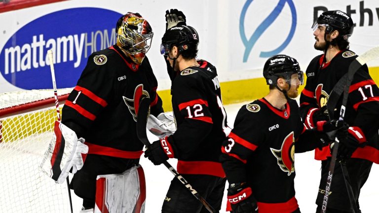 Ottawa Senators goaltender Leevi Merilainen celebrates the team's win with teammate Shane Pinto (12) at the end of third-period NHL action against the Dallas Stars, in Ottawa, Sunday, Jan. 12, 2025. (CP/Justin Tang)