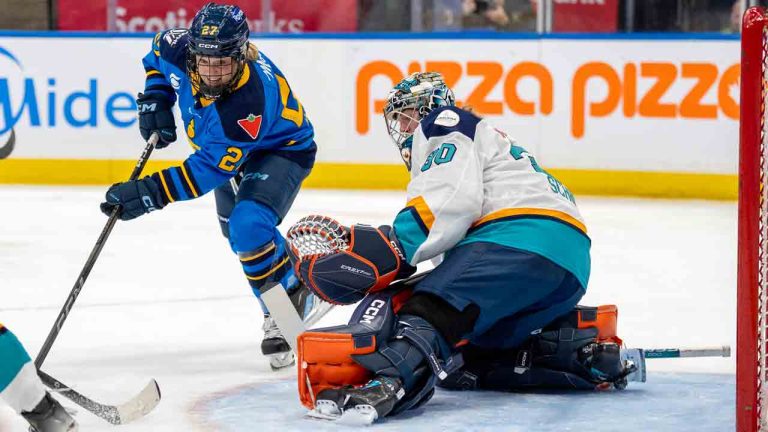 Toronto Sceptres forward Emma Maltais (27) chases down the puck after a save by New York Sirens goaltender Corinne Schroeder (30) during first period PWHL hockey action in Toronto on Saturday January 25, 2025. (Frank Gunn/CP)