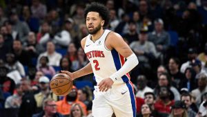 Detroit Pistons guard Cade Cunningham (2) brings the ball up the court against the Orlando Magic during the first half of an NBA basketball game. (Phelan M. Ebenhack/AP)