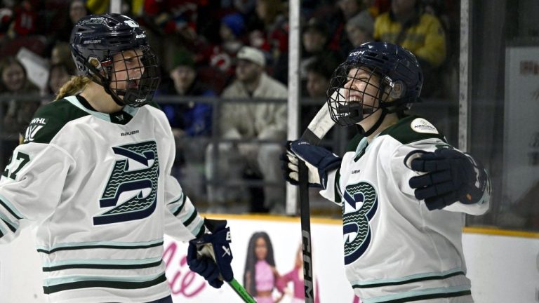 Boston Fleet's Sidney Morin (7) celebrates her game winning goal against the Ottawa Charge with Shay Maloney (27) overtime period PWHL hockey action in Ottawa, on Saturday, Jan. 11, 2025. (Justin Tang/CP)