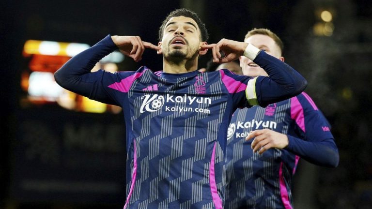 Nottingham Forest's Morgan Gibbs-White, left, celebrates scoring their side's first goal of the game during the Premier League match at Molineux Stadium, Wolverhampton, England, Monday Jan. 6, 2025. (Mike Egerton/PA via AP)