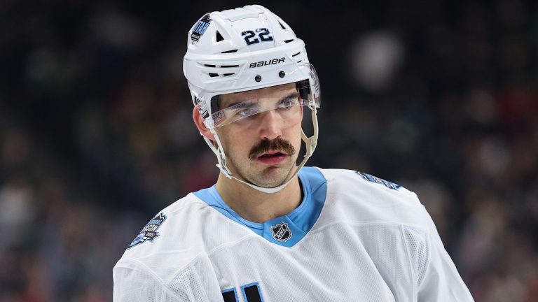Utah Hockey Club center Jack McBain (22) looks on during the first period of an NHL hockey game against the Minnesota Wild Friday, Dec. 20, 2024, in St. Paul, Minn. (AP Photo/Matt Krohn)