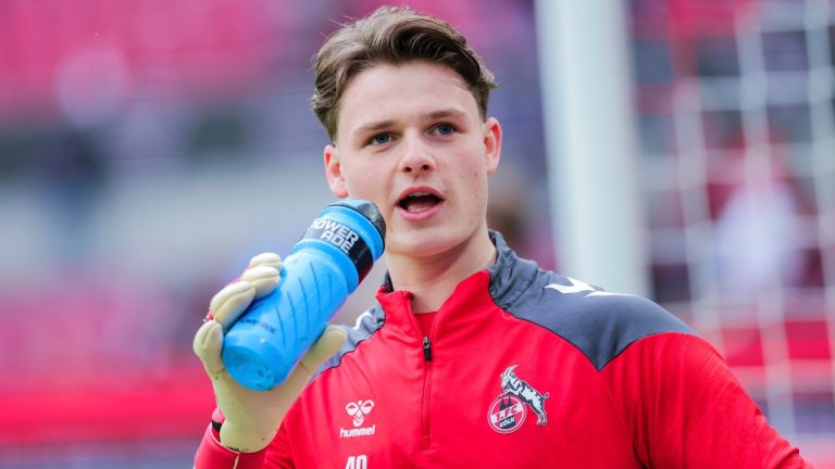 Cologne goalkeeper Jonas Urbig warms up ahead of the Bundesliga 2 match between FC Koln and SV Elversberg, Saturday Jan. 25, 2025. (Rolf Vennenbernd/dpa via AP)