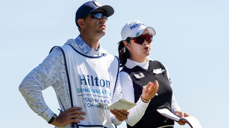 A Lim Kim, right, talks to her caddie, left, during the first round of the Hilton Grand Vacations Tournament of Champions LPGA golf tournament in Orlando, Fla., Thursday, Jan. 30, 2025. (Kevin Kolczynski/AP)
