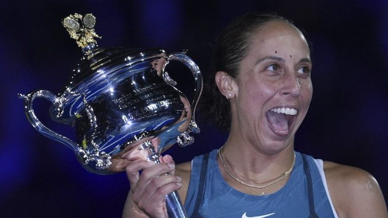 Madison Keys of the U.S. reacts as she receives the the Daphne Akhurst Memorial Cup from Evonne Goolagong Cawley after defeating Aryna Sabalenka of Belarus in the women's singles final at the Australian Open tennis championship in Melbourne, Australia, Saturday, Jan. 25, 2025. (Ng Han Guan/AP)

