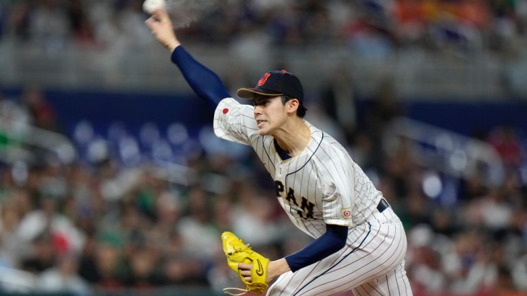 FILE - Japan's Roki Sasaki delivers a pitch during the first inning of a World Baseball Classic game against Mexico, Monday, March 20, 2023, in Miami. 2024.(AP/Wilfredo Lee, File)