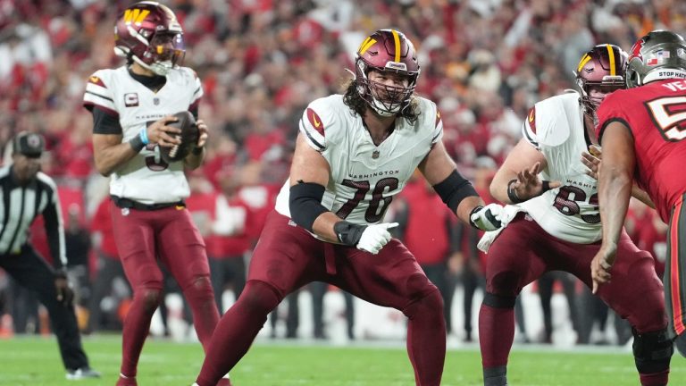 Washington Commanders guard Sam Cosmi (76) protects the pocket during an NFL Wild Card playoff game against the Tampa Bay Buccaneers, Sunday, Jan 12, 2025, in Tampa, Fla. (AP/Peter Joneleit)