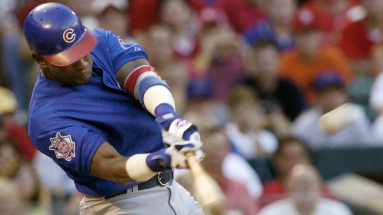 FILE - Chicago Cubs' Sammy Sosa connects for a three-run home run in the third ining against the St. Louis Cardinals Sunday, July 11, 2004 at Busch Stadium in St. Louis. (AP/Tom Gannam, File)