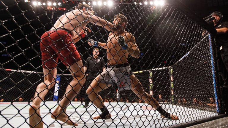 Oliver Aubin-Mercier, left, fights Arman Tsarukyan at UFC 240 in Edmonton in 2019. (Jason Franson/CP)